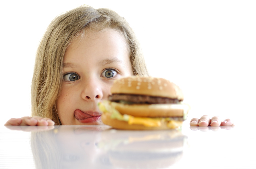 child eyeing a hamburger - a metaphor for coping with craving