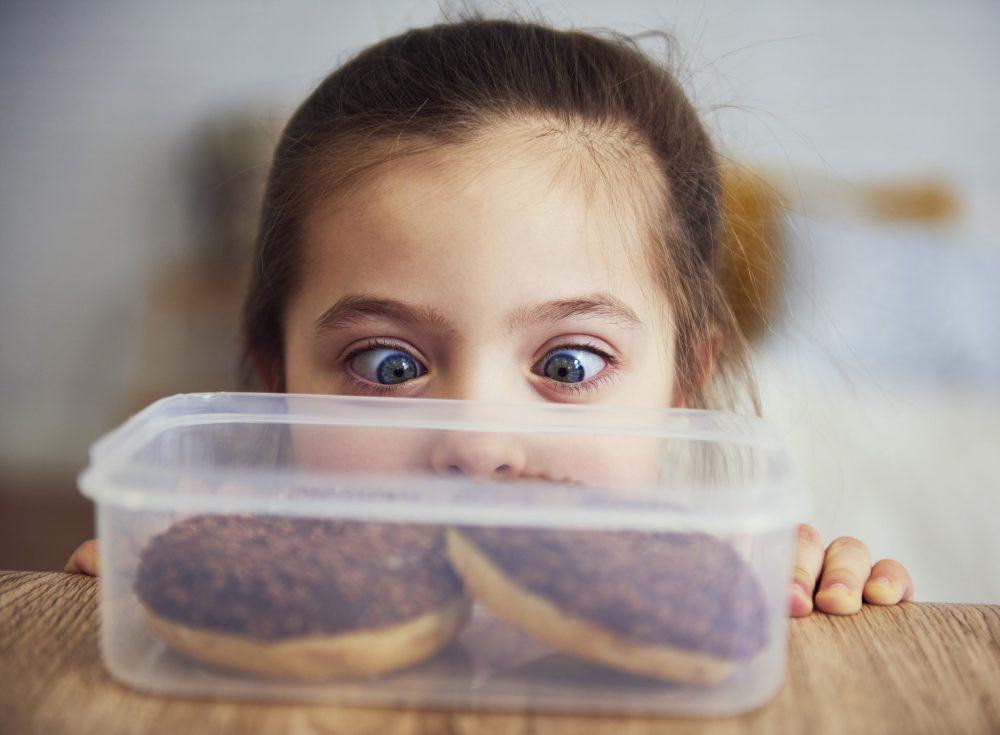 Child craving donuts - metaphor for addiction and desire