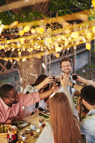 friends drinking wine at holiday party