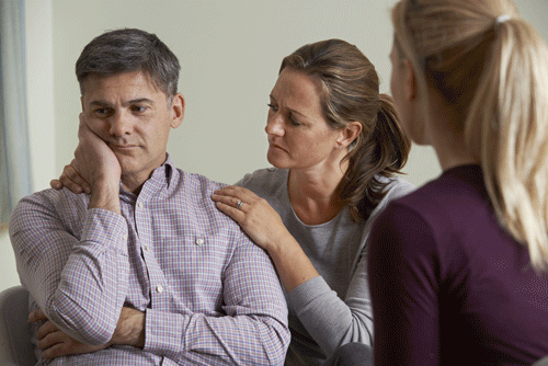 wife talking to husband about addiction treatment