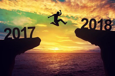 image of man jumping into 2018 to symbolize new year resolutions