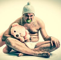 man in baby costume to symbolize the way we infantilize addiction