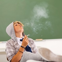 image of a boy smoking to symbolize teenage substance abuse