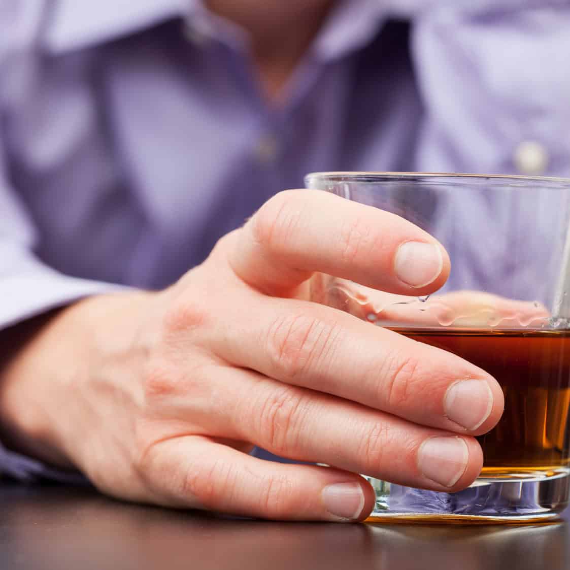 Businessman with glass of whisky