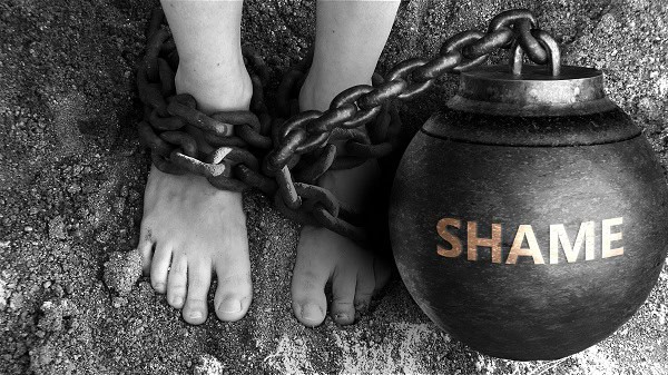 image of ball and chain to symbolize understanding shame as a weight