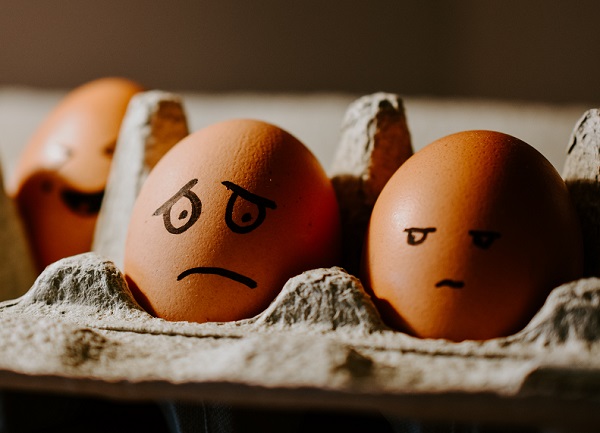 image of eggs in a carton with faces drawn on them to conceptualize coping with worry