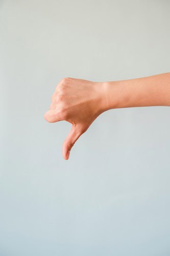image of thumbs down for negativity bias